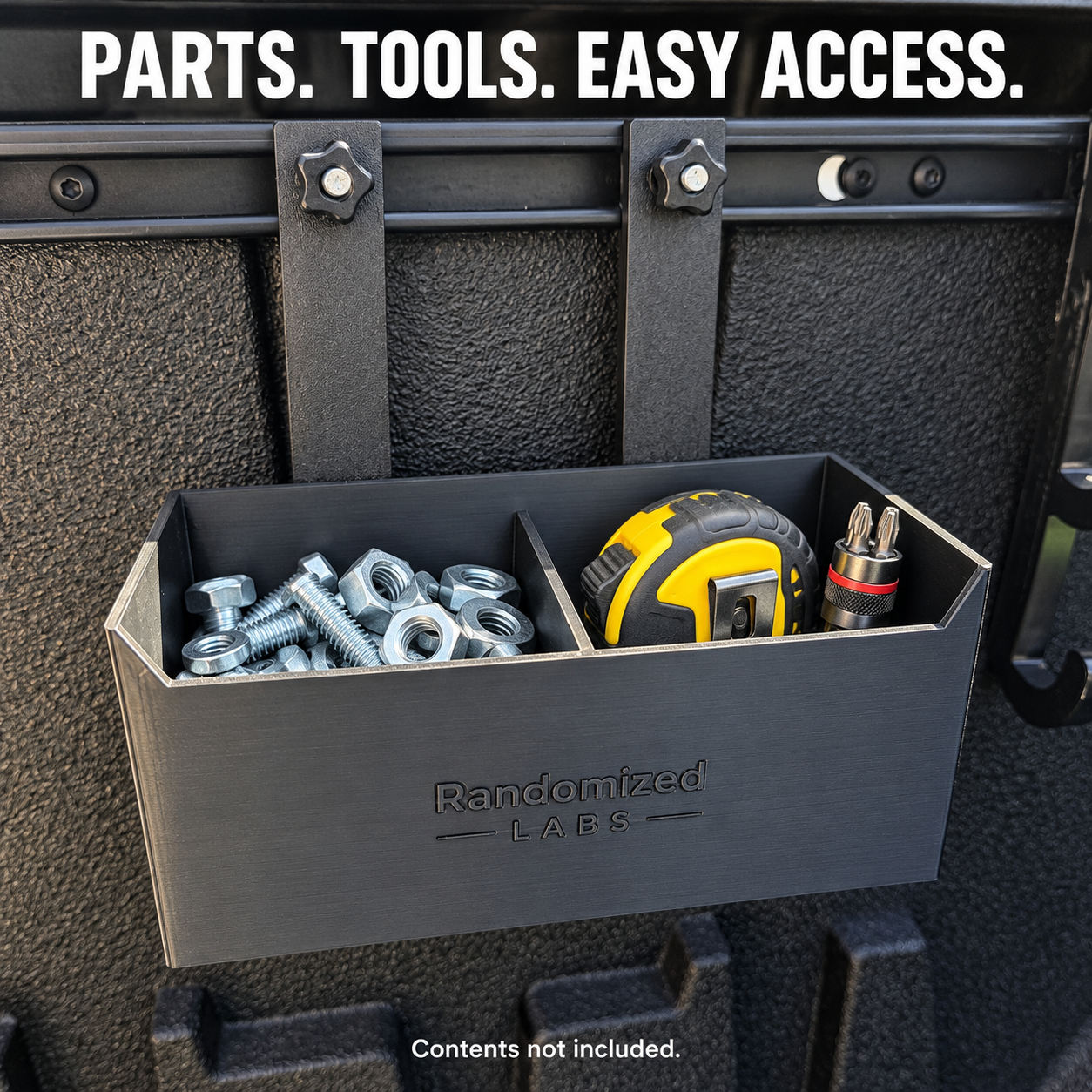 Rail-mounted Storage Box holding hardware, a tape measure and driver bits; contents not included